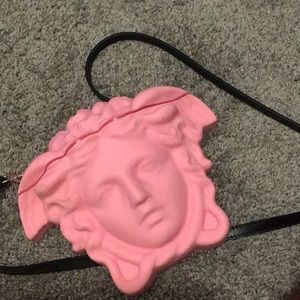 A versace medusa purse in the color pink !